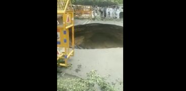 large portion of road caves in Delhi