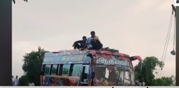 Youth Perform Stunt Hanging on Vehicle