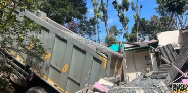 Taurus Lorry Overturns onto House in Nedumkandam